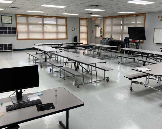 Dozens of teachers and staff cut as East Side district approves controversial budget plan